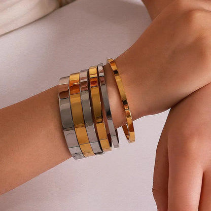 Minimalist Gold-Tone Stainless Steel Bangle Bracelet – Waterproof Oval Design for Women